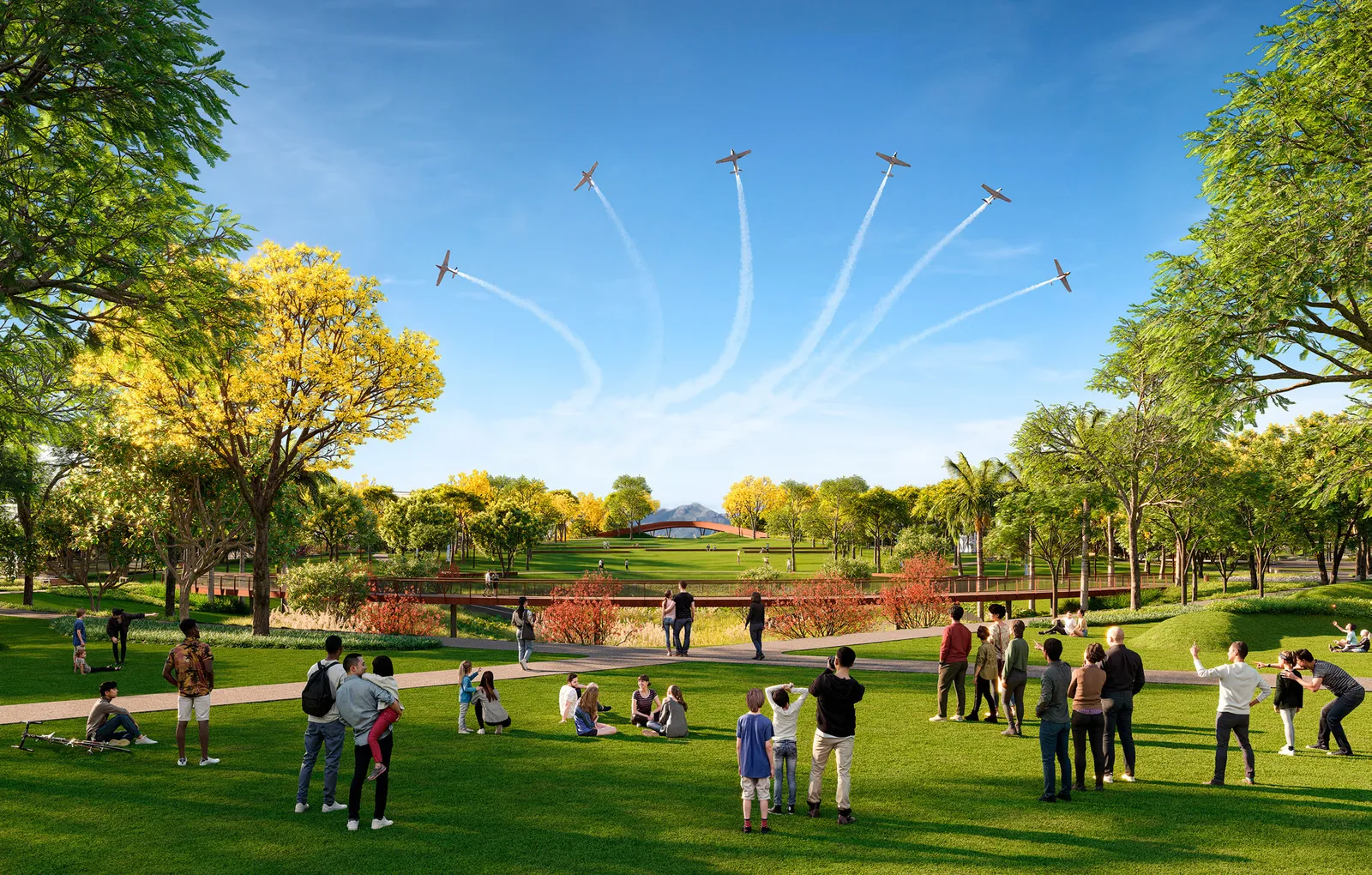 Render do parque ao fim da tarde: pessoas sentadas e em pé no gramado olhando a esquadrilha de aviões que risca o céu de fumaça, com a serra ao fundo.