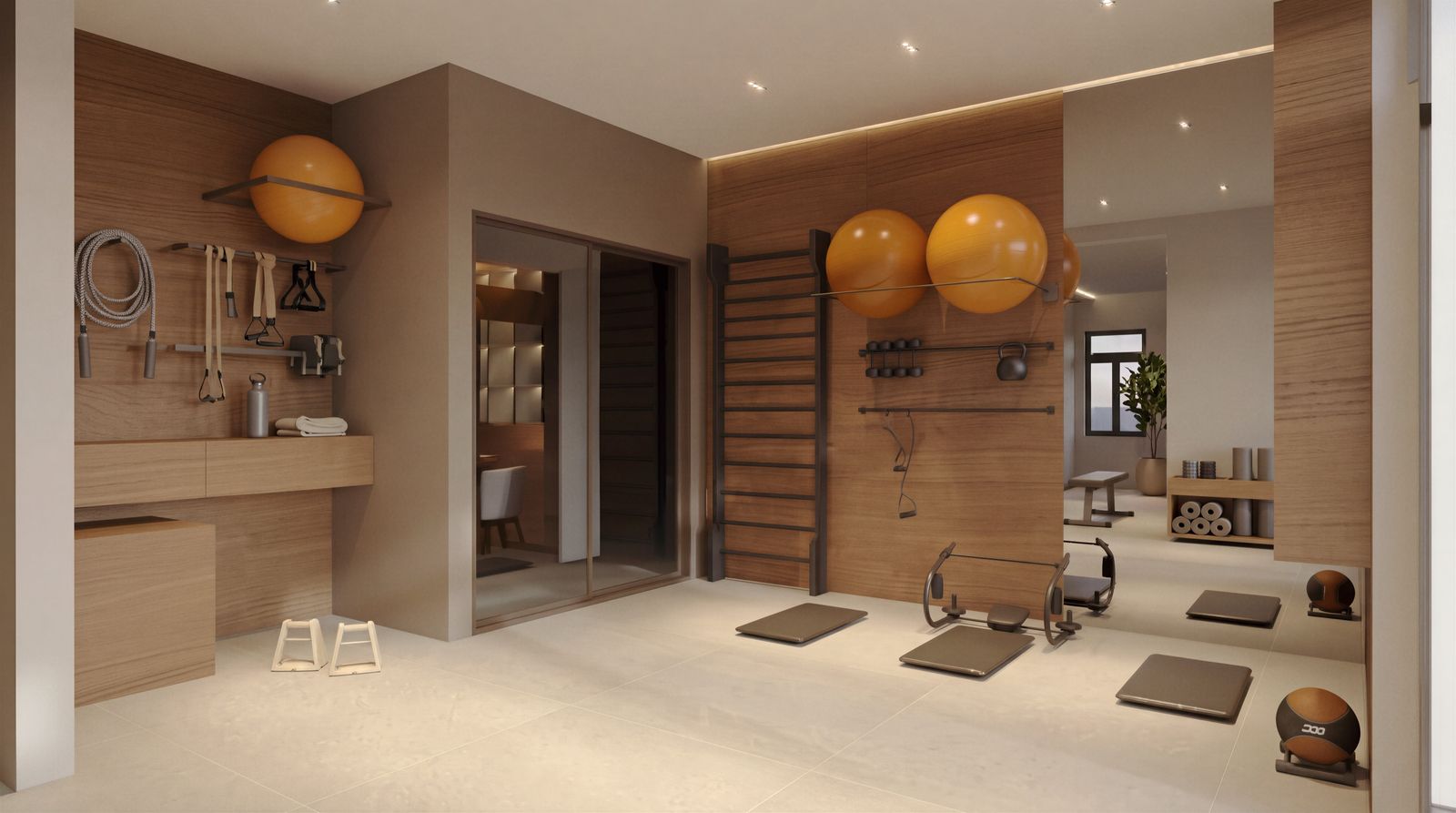 Perspectiva da área de pilates do Verah com espaldar, bolas suíças, faixas e acessórios no painel de madeira e piso amplo